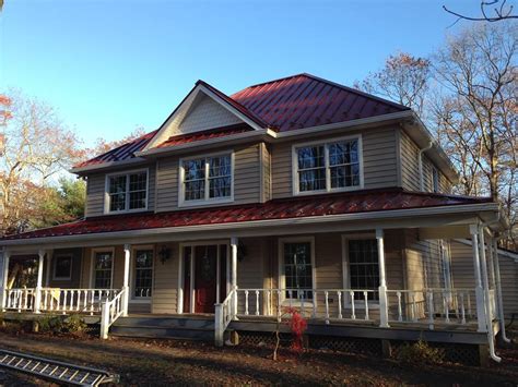 red house with green metal roof|colonial red roof.